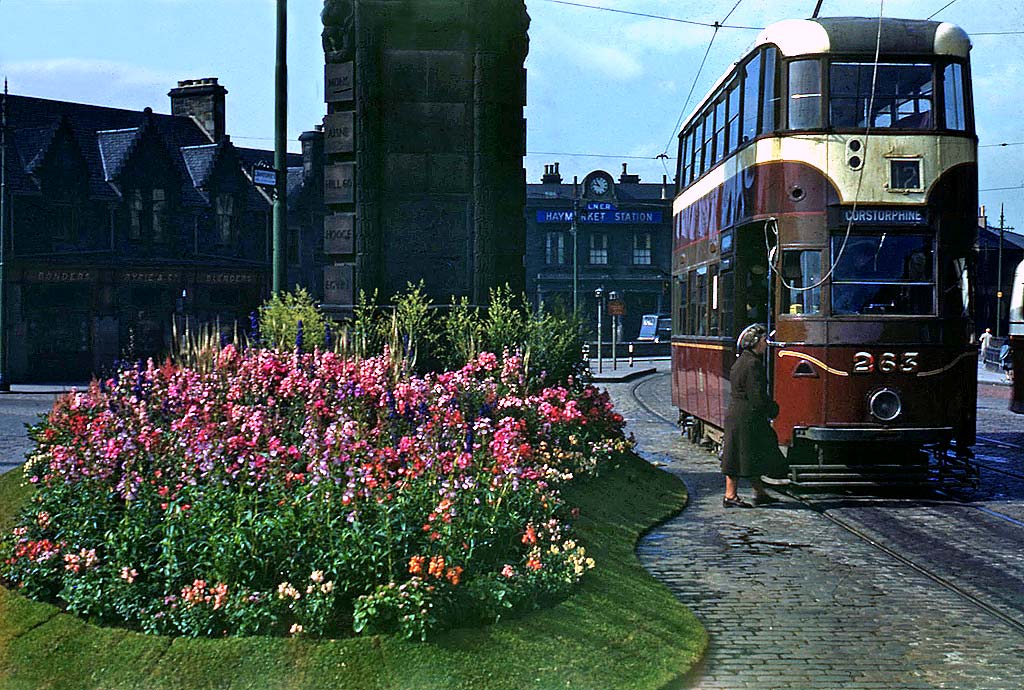 A tram passes Haymarket Station and Clock  -  1950s