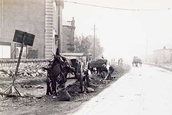 Work, probably in connection with laying or removing tramway tracks.  Can anybody tell me where or when this photograph  may have been taken?