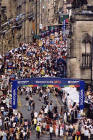 Crowds gather at the Royal Mile to watch the street theatre during the Edinburgh Festival in August 2003