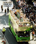 Edinburgh Festival Cavalcade 2004  -  Performers in Golden Costumes in an Open-Top Bus