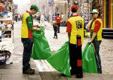 Three litter collectors wait in the Royal Mile at about 10am for the crowds to gather.