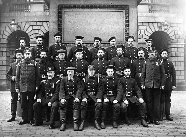 Firfighters standing in front of Parliament House and the statue to Charles II in Parliament Square, Edinburgh  -  Late-1890s