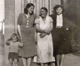 A young boy and three ladies at East Thomas Street, around 1940