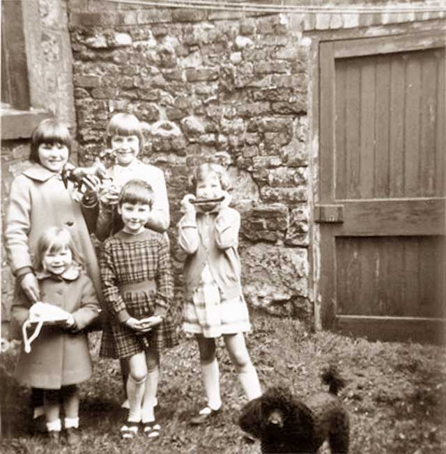 Burns Family girls and others in the small back garden of 160 Canongate, Edinburgh