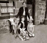 Patterson family and bird cages outside No 6, East Thomas Street