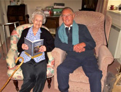 Allan Dodds (former pupil at George Heriots Primary School) sitting beside his former teacher, Agnes Hamilton