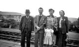 A group of five from Willie Lisowski's family standing on a platform in 1955.  Which station is this likely to be?