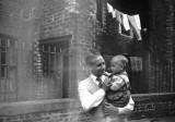 Peter P Weddell holding Paul Weddell at Holyrood Square, Edinburgh -  1956