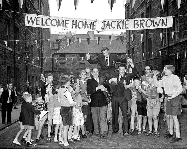 Boxer, Jackie Brown is welcomed home to Lyne Street with his Empire Games Gold Medal, July 1958