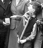 Bill Cunningham, one of a group of local residents in Lyne Street, Abbeyhill, welcoming home Jackie Brown from the Empire Games with his Boxing Medal