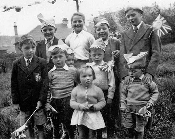 Photograph of children at a Coronation Party held in the Backgreen at Marionville Road, 1953