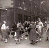 Street Entertainment to mark the coronation of Queen Elizabeth II, 1953  -  'The Farmer's in his Den'