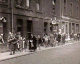 Street Entertainment to mark the coronation of Queen Elizabeth II, 1953  -  'The Pied Piper'