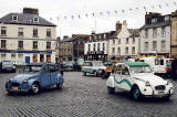 Citroen 2CVs in the centre of Kelso in the Scottish Borders  -  during the World 2CV Meeting held at Kelso, July 2005