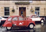 Citroen 2CVs in the centre of Kelso in the Scottish Borders  -  during the World 2CV Meeting held at Kelso, July 2005