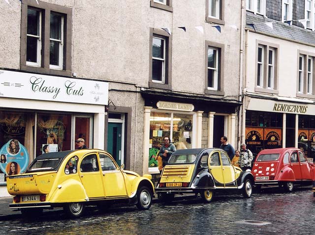 Citroen 2CVs in the centre of Kelso in the Scottish Borders  -  during the World 2CV Meeting held at Kelso, July 2005