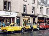 Citroen 2CV in the centre of Kelso in the Scottish Borders  -  during the World 2CV Meeting held at Kelso, July 2005