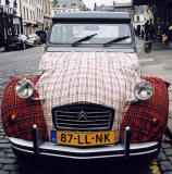 Citroen 2CV in the centre of Kelso in the Scottish Borders  -  during the World 2CV Meeting held at Kelso, July 2005