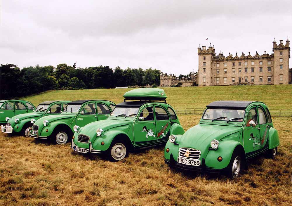 Citroen 2CV cars  in the grounds of Floors Castle,  Kelso, in the Scottish Borders  -  during the World 2CV Meeting held at Kelso, July 2005   -  Large photo