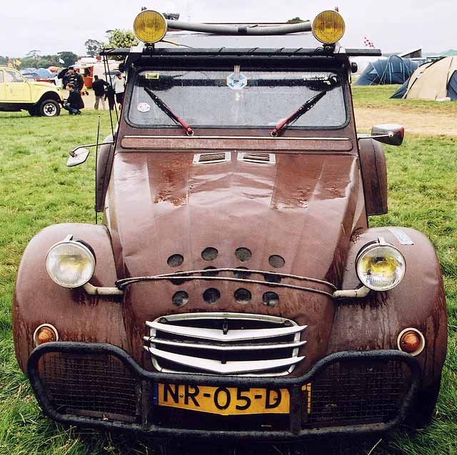 A Citroen 2CV in the grounds of Floors Castle,  Kelso, in the Scottish Borders  -  during the World 2CV Meeting held at Kelso, July 2005