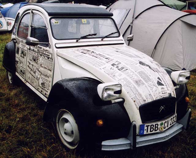 A Citroen 2CV in the grounds of Floors Castle,  Kelso, in the Scottish Borders  -  during the World 2CV Meeting held at Kelso, July 2005