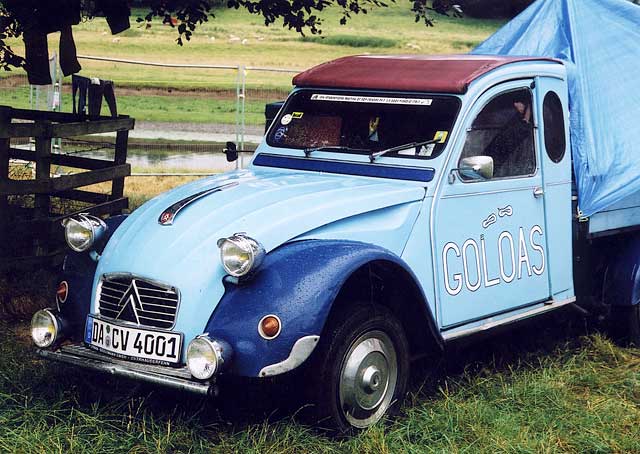 A Citroen 2CV in the grounds of Floors Castle,  Kelso, in the Scottish Borders  -  during the World 2CV Meeting held at Kelso, July 2005