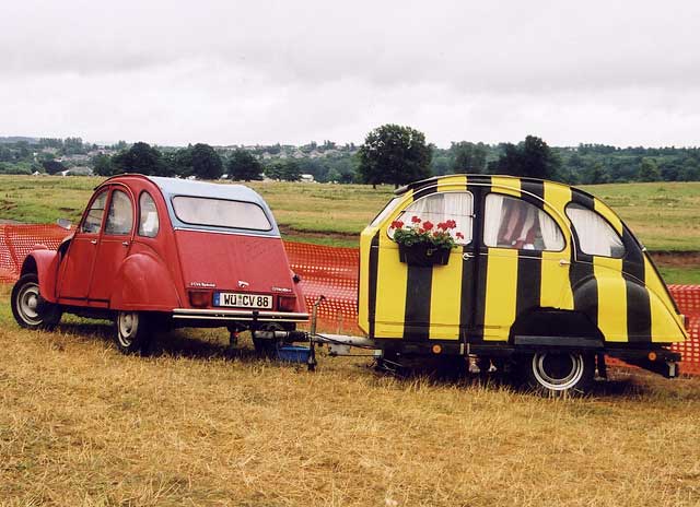 A Citroen 2CV in the grounds of Floors Castle,  Kelso, in the Scottish Borders  -  during the World 2CV Meeting held at Kelso, July 2005