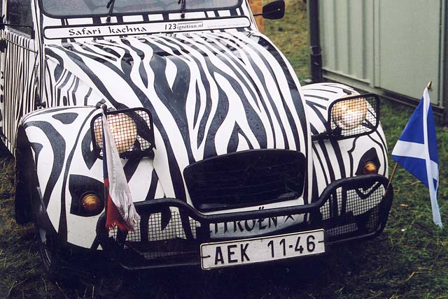 A Citroen 2CV in the grounds of Floors Castle,  Kelso, in the Scottish Borders  -  during the World 2CV Meeting held at Kelso, July 2005