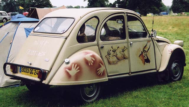 A Citroen 2CV in the grounds of Floors Castle,  Kelso, in the Scottish Borders  -  during the World 2CV Meeting held at Kelso, July 2005