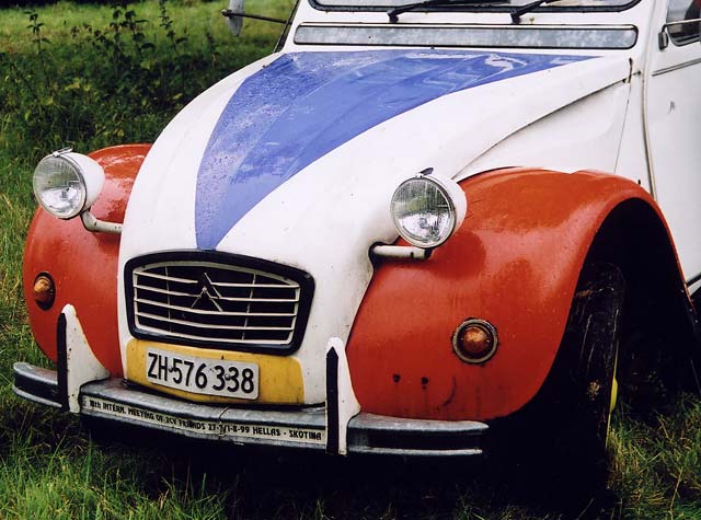 A Citroen 2CV in the grounds of Floors Castle,  Kelso, in the Scottish Borders  -  during the World 2CV Meeting held at Kelso, July 2005