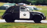 Zoom-out to a  Citroen 2CV in the grounds of Floors Castle,  Kelso, in the Scottish Borders  -  during the World 2CV Meeting held at Kelso, July 2005