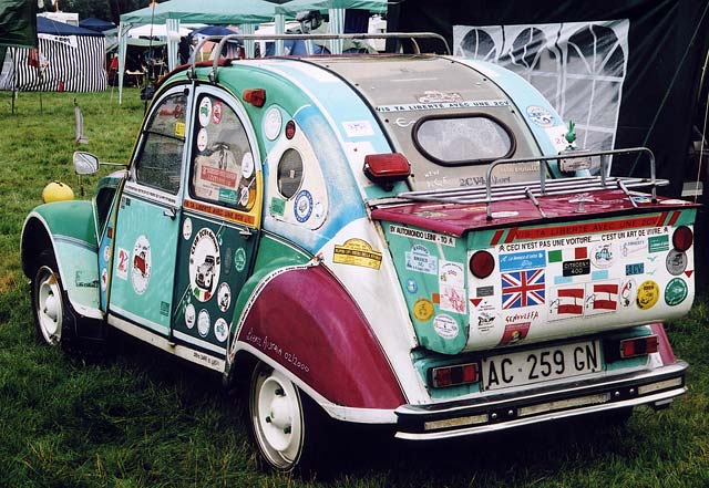 A Citroen 2CV in the grounds of Floors Castle,  Kelso, in the Scottish Borders  -  during the World 2CV Meeting held at Kelso, July 2005