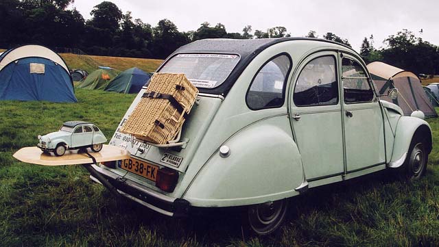 A Citroen 2CV in the grounds of Floors Castle,  Kelso, in the Scottish Borders  -  during the World 2CV Meeting held at Kelso, July 2005