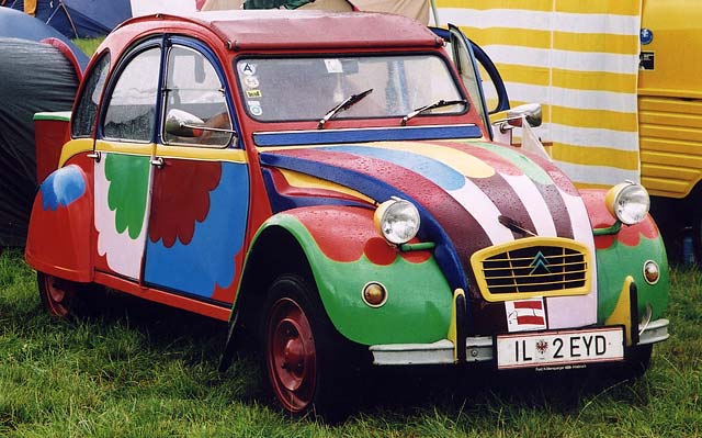 A Citroen 2CV in the grounds of Floors Castle,  Kelso, in the Scottish Borders  -  during the World 2CV Meeting held at Kelso, July 2005