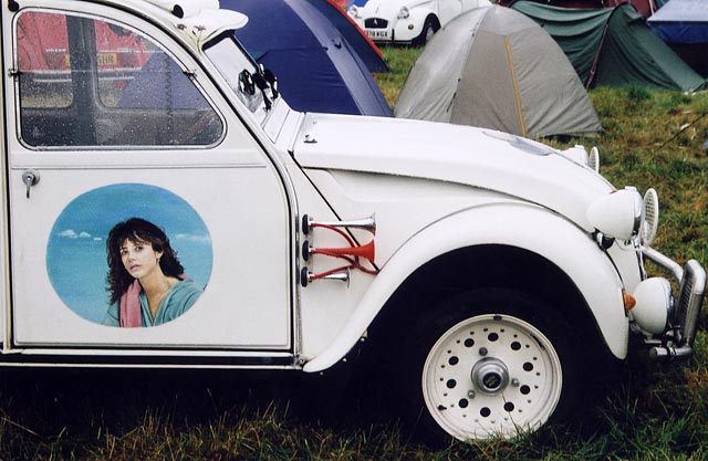 A Citroen 2CV in the grounds of Floors Castle,  Kelso, in the Scottish Borders  -  during the World 2CV Meeting held at Kelso, July 2005