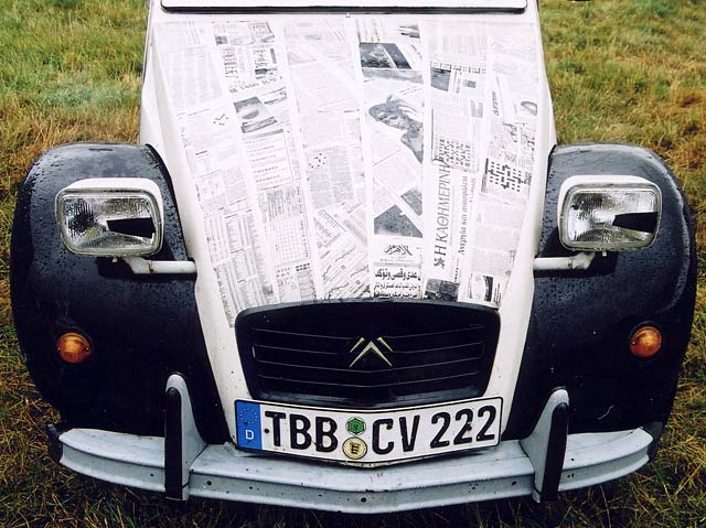 A Citroen 2CV in the grounds of Floors Castle,  Kelso, in the Scottish Borders  -  during the World 2CV Meeting held at Kelso, July 2005