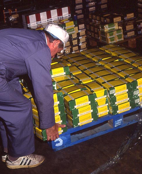 Duncan's Chocolate Factory  -  Beaverhall Road, Edinburgh,  1991  -  A worker dispatching the finished product