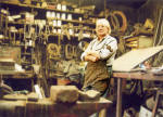 Alexander McLennan with his hammer, in the middle of his blacksmiths workshop at Powderhall