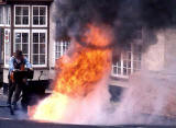 People at work around Britain  -  Burning tar off the road at Exford, Somerset, 1985