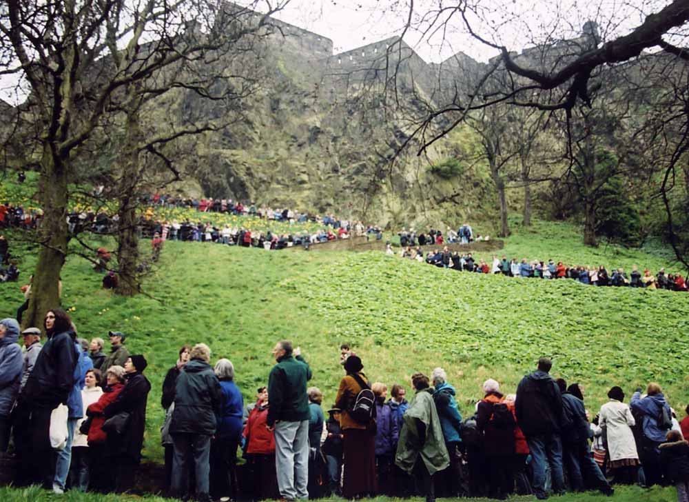 The Easter Play in West Princes Street Gardens  -  26 March 2005  -  The audience lines the paths on Caltle Rock, awaiting the Crucifixion scene.  Edinburgh Castle is in the background.