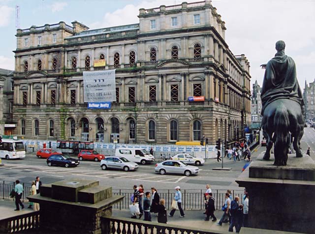 Photograph by Peter Stubbs  -  August 2002  -  View from the steps of Register House, looking past Steele's statue of the Duke of Wellington, towards the North Bridge and General Post Office.