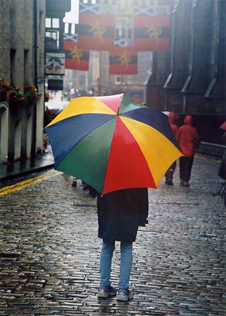 Photograph by Peter Stubbs  -  Edinburgh  -  August 2002  -  Umbrella in the Royal Mile