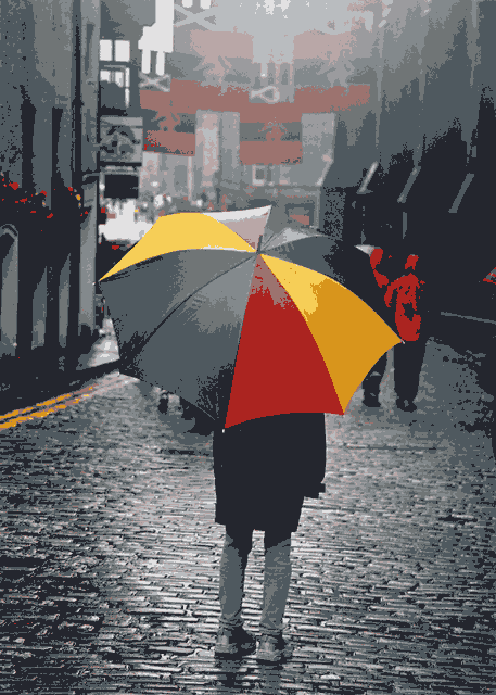 Photograph by Peter Stubbs  -  Edinburgh  -  August 2002  -  Umbrella in the Royal Mile