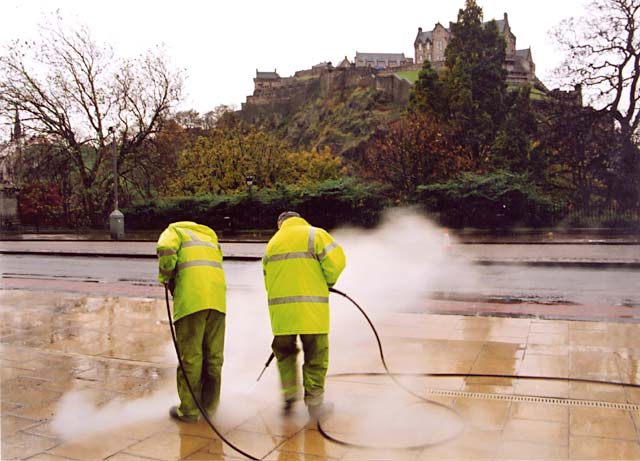 Photograph bt Peter Stubbs  -  Edinburgh  -  November 2002  -  Cleaning Princes Street Pavement