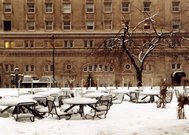 Looking across Sherbrooke Street from Standard Life's Canadian Head Office to the Ritz Hotel.  The tables are outside Standard Life's building.