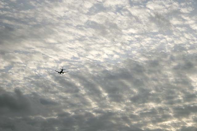 Sky over Silverknowes, Edinburgh  -  with plane approaching Edinburgh Airport