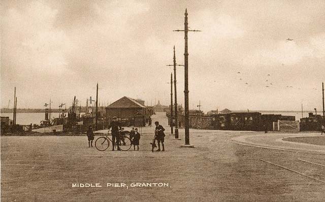 Granton Middle Pier, with a family and cycle at Granton Square