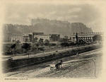 Zoom-in to the picture on the front of a postcard by an unidentified publisher  -   Looking to the south-west, across Princes Street towards the National Galleries and Edinburgh Castle on Castle Hill