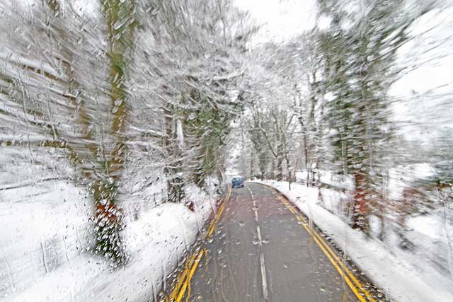 View form the top deck of a No 23 bus travelling to the west along Glenlockhart Road beside the Merchants of Edinburgh Golf Course, towards the Craighouse Campus of Napier University  -  Christmas Eve, 2009