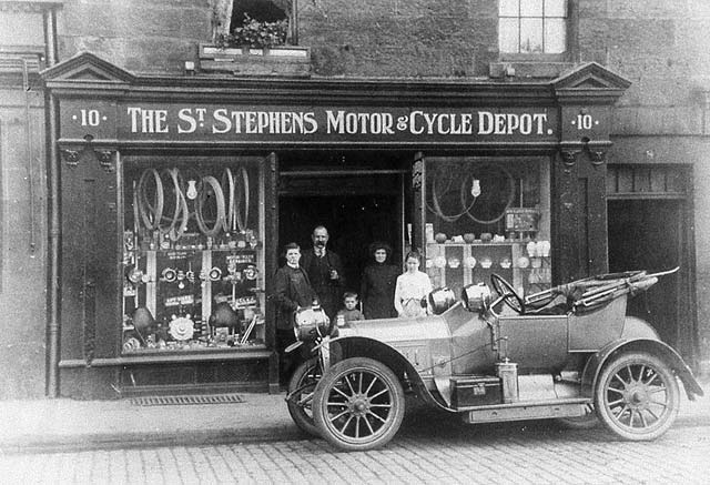 Old Car parked outsideThe St Stephen's Motor Cycle Depot 